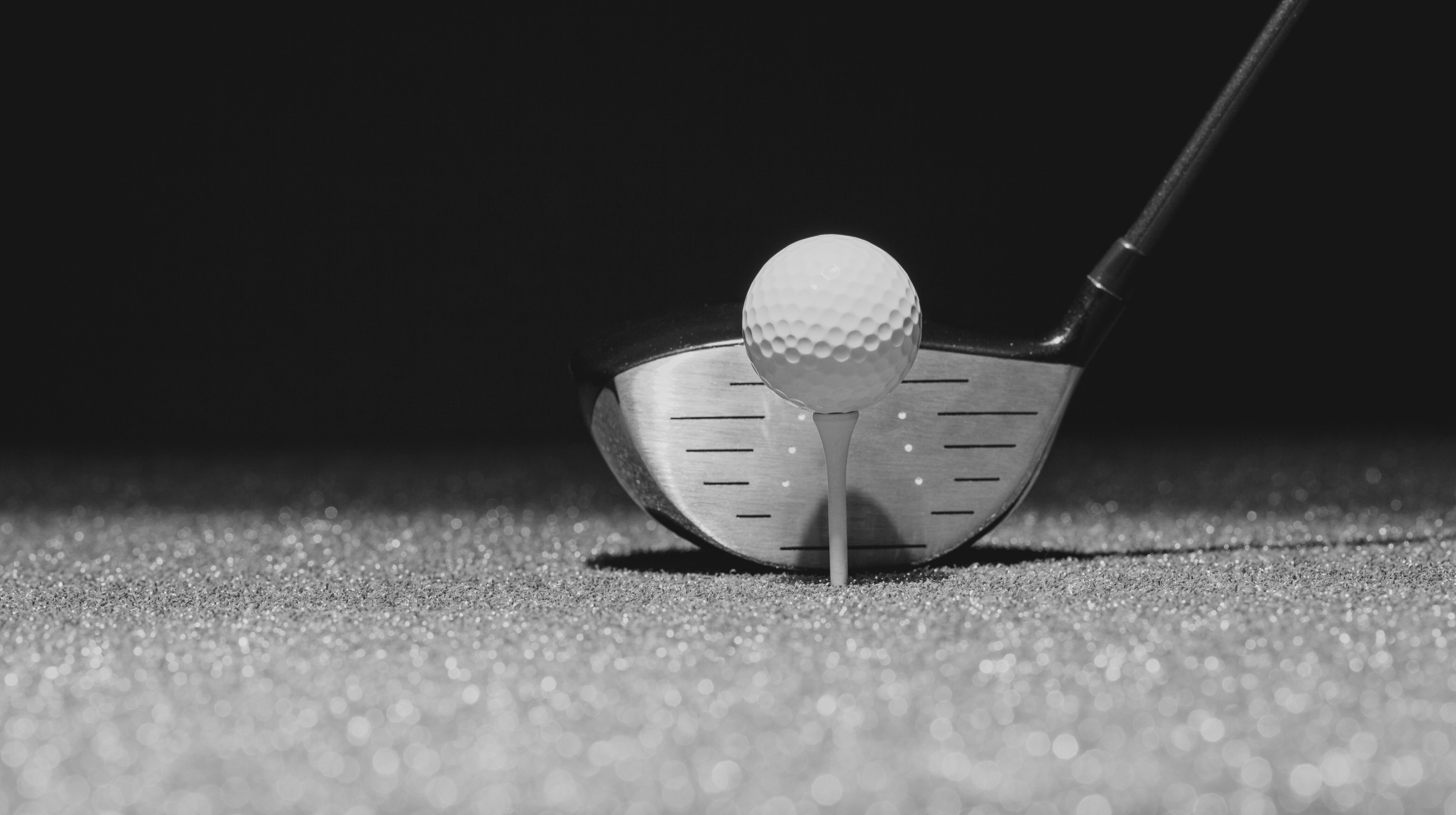 Low Angle Selective Focus of Golf Ball and Driver on a Green Wit Edited